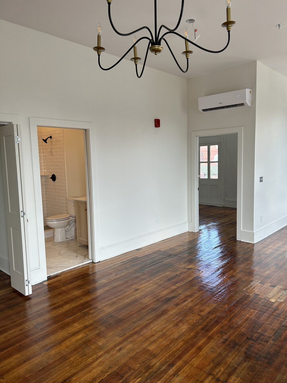 Hardwood floors, chandelier, and bath finishes