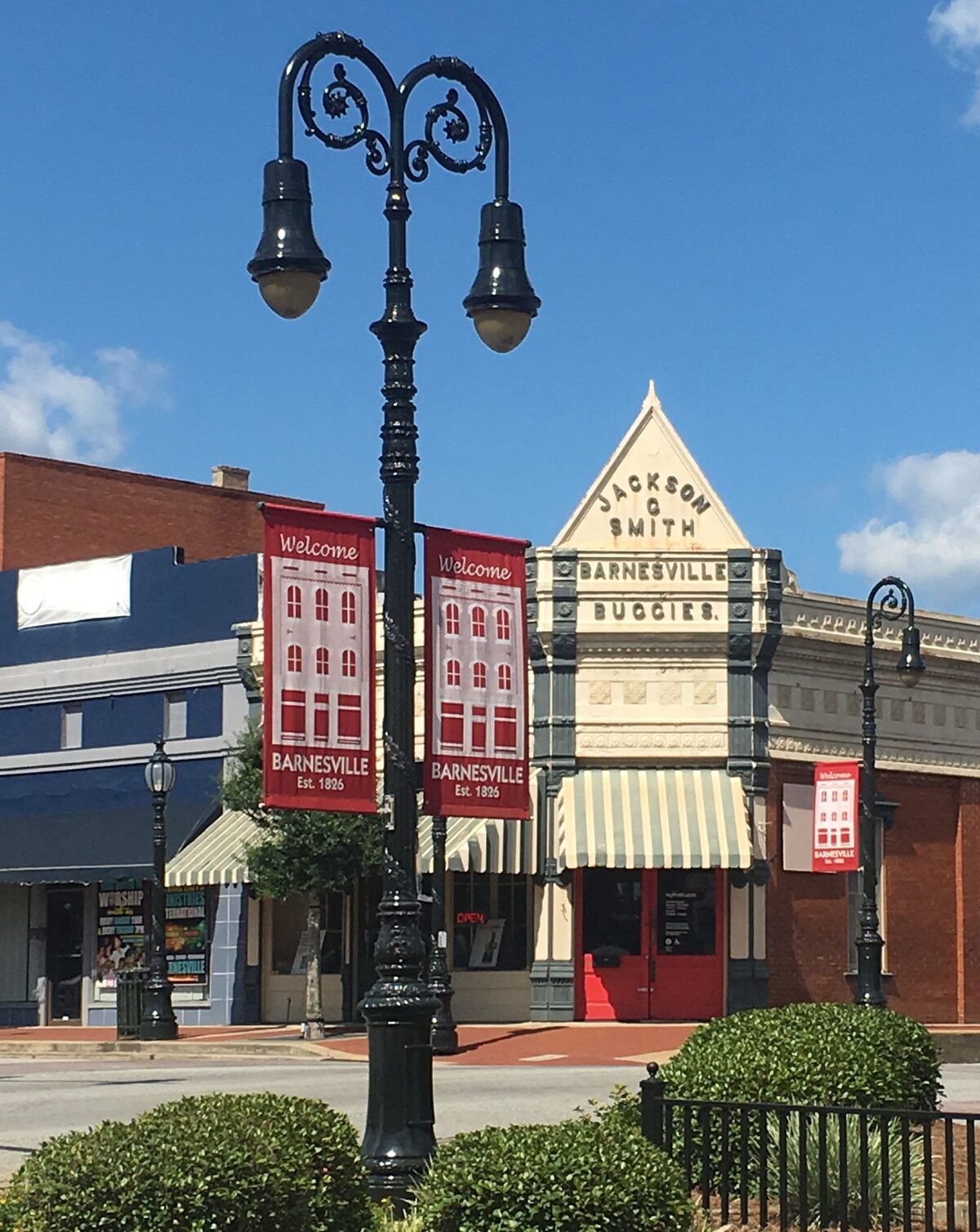 Downtown Barnesville - Jackson & Smith Barnesville Buggies building with Welcome banners